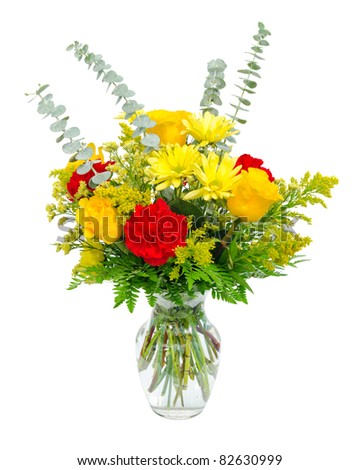 Colorful flower arrangement centerpiece  in glass vase with roses, lilies  and carnations isolated on white