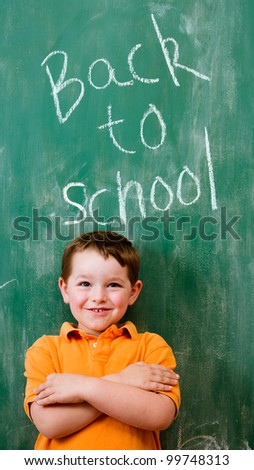 Back to school education concept with child in front of chalkboard