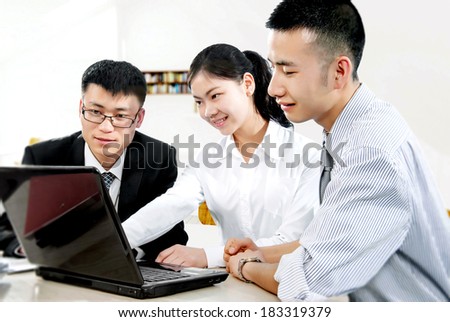 Three business personnel working in the office
