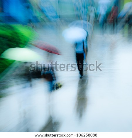 big city people walk on road in rainy day, blurred motion abstract background.
