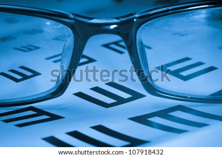 medical eye chart and glasses