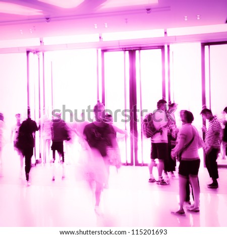 pink business people activity standing and walking in the lobby motion blurred abstract background