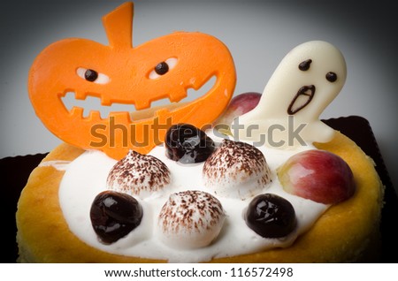 Halloween cake with pumpkin background