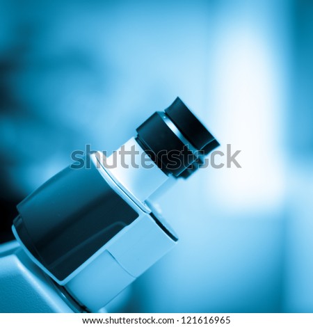 blue science equipment microscope background