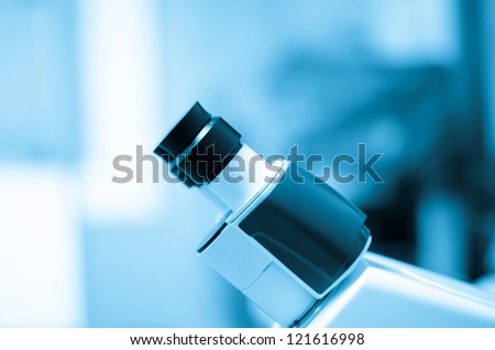 blue science equipment microscope background