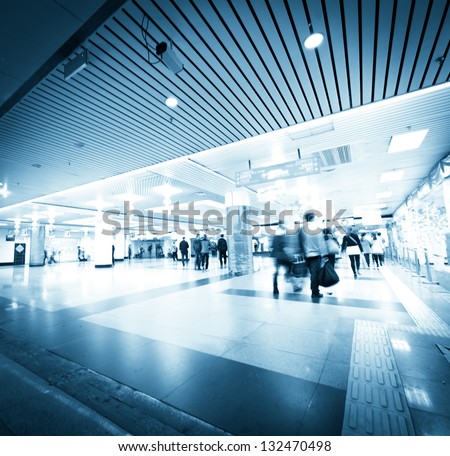 abstract business people rush on urban shopping center blur motion