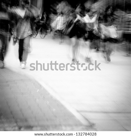 business people on urban city street blur black and white
