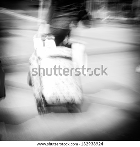 walking passenger with traveling case blur motion