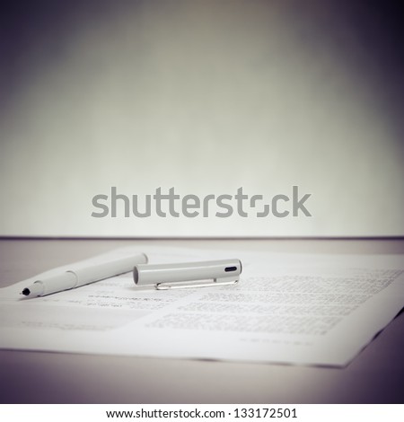 business pen and paper on desk