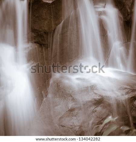 beautiful zen garden waterfall in slow shutter