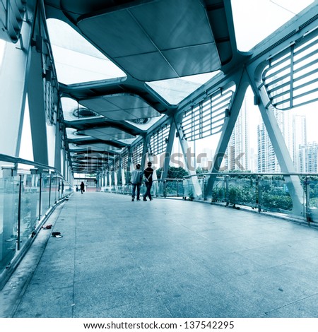 people walking on modern urban city platform bridge,blur motion.