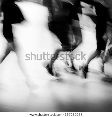 abstract business people walking on city street, black and white motion blurred.