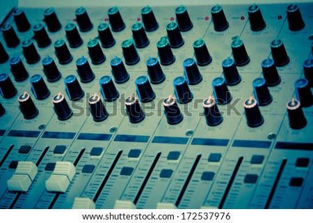 sound studio adjusting record equipment