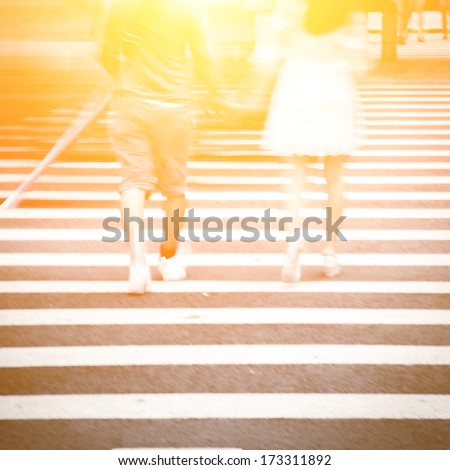 crosswalk and pedestrian at modern city zebra crossing street, blur abstract