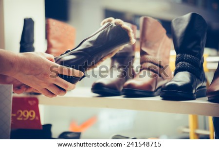 buy shoes in a footwear shop.
