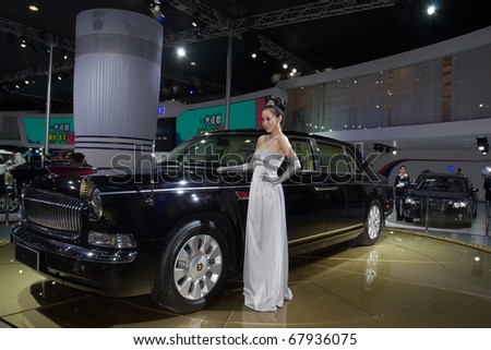 GUANGZHOU, CHINA - DEC 27: Fashion Model on car at the 8th China international automobile exhibition on December 27, 2010 in Guangzhou China.