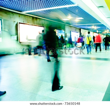 Business passenger walk at subway station at intentional motion blurred