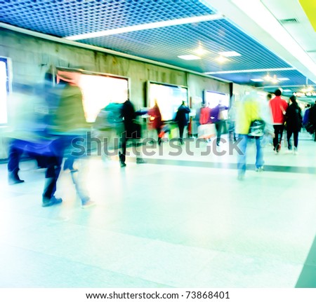 Business passenger at subway station at intentional motion blurred