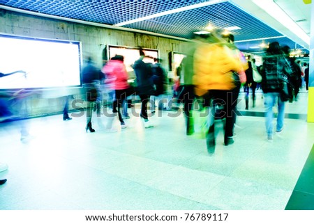 Business passenger walk at subway station at intentional motion blurred