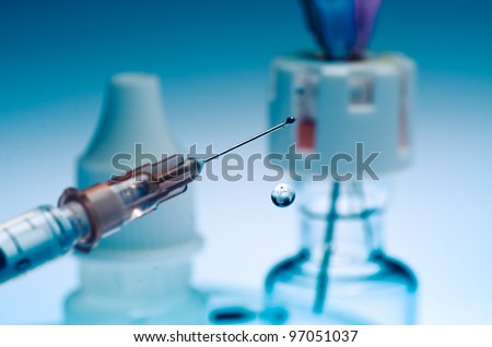medical syringe squirting fluid