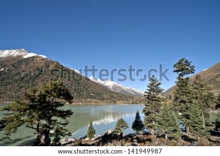 the beautiful lake under the blue sky and the snow mountain.