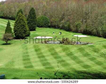 Golfers playing on a Golf Course set in the English Chiltern Hills