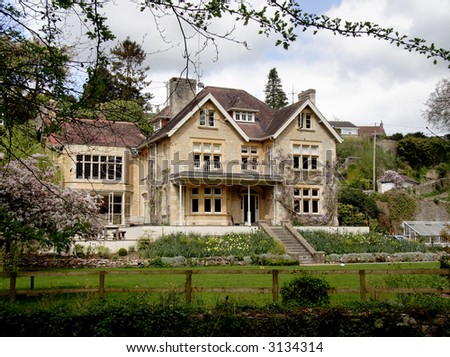 Winter sunshine on a Natural Stone  Mullion windowed English Manor House