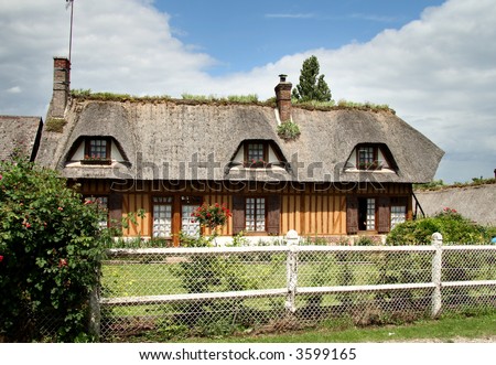 Thatched Timber Framed Village House in Normandy, France with a cottage garden to the front