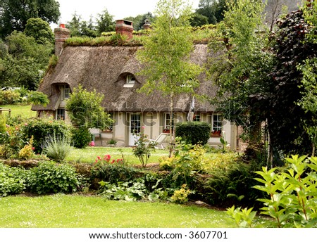 Thatched Timber Framed House in Normandy, France with a cottage garden to the front