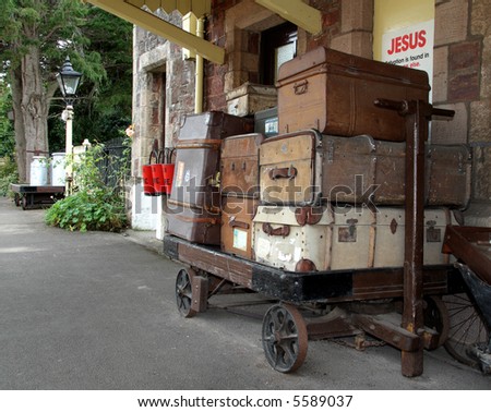 Nostalgic view of old Luggage and Baggage on a Platform Trolley at a Train Station in England