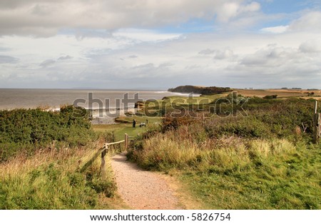 Coastal path in England looking out to Sea with people in the background