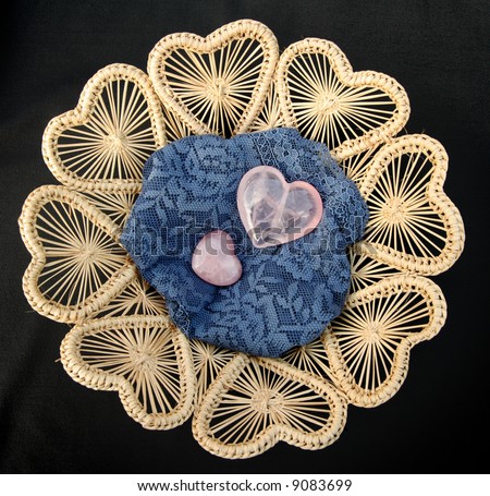 Crystal Hearts sitting on Blue Lace and a Heart shaped Wicker Basket