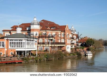 Commercial and Residential Buildings on the banks of the River Thames in Windsor against a blue Winter Sky