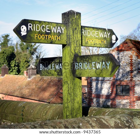Moss covered Bridleway and Footpath Sign on an English Rural Path