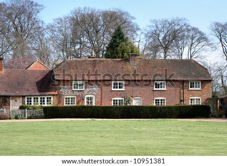 Traditional part Brick and Flint  English Village Houses with a Cricket Green in front