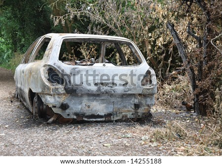 Burnt out Car Wreck on a country path