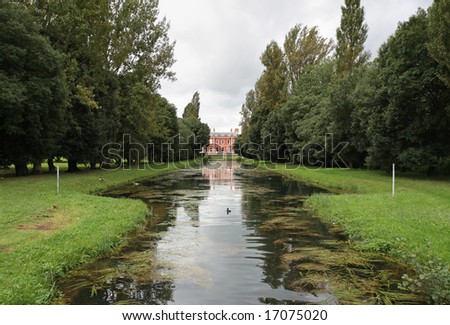 Avenue of Trees and a Canal leading to an English Mansion