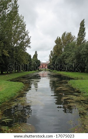Avenue of Trees and a Canal leading to an English Mansion