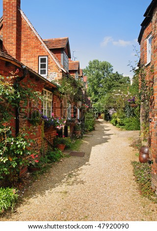 Path leading past a Row of English Village Houses