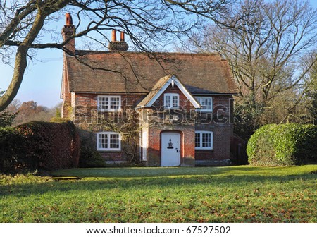A Traditional red brick English Village House in Winter sunshine