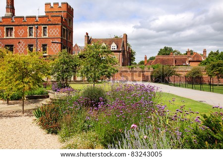 A Formal English garden with Historic College in the background