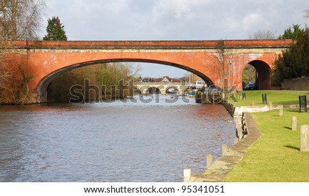 The River Thames in Maidenhead Berkshire, with Brunels Sounding Arch Railway Bridge in the foreground