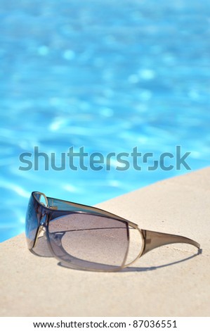 Sun glasses at the swimming pool