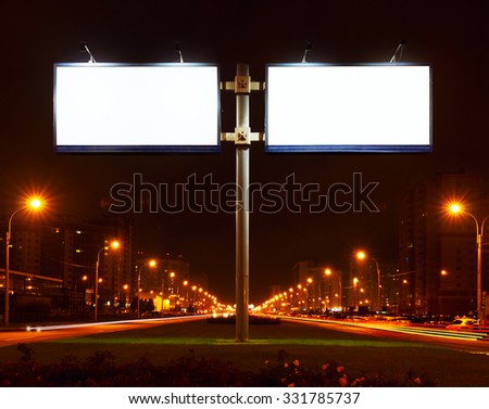 Double big white bill-board on lighting street at night