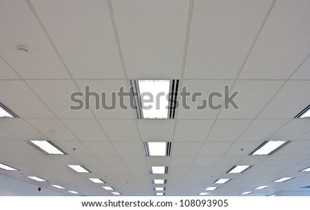 Lights from ceiling of business office building