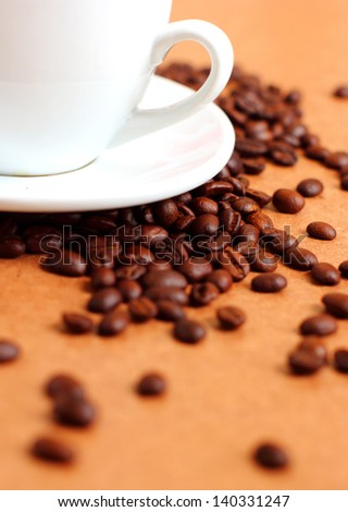 Part of white cup coffee with coffee beans