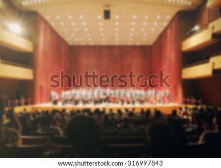 Blurred background of audiences in orchestra symphony theater hall