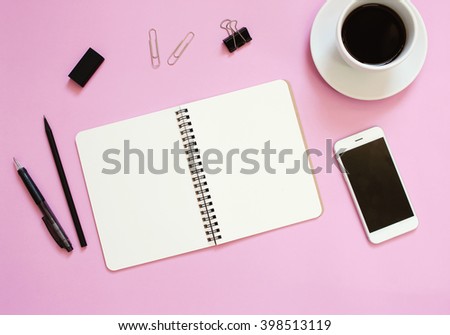 Creative flat lay mockup design of workspace desk with blank notebook, smartphone, coffee, stationery with copy space background