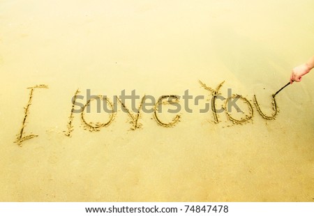 i love you in japanese writing. stock photo : Hand writing I love you on sand and beach