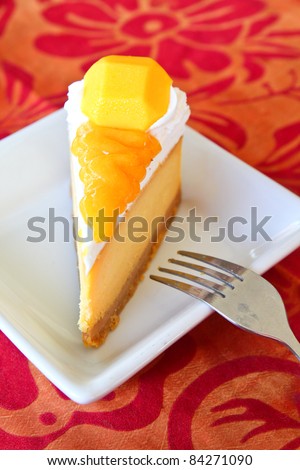 mango cheesecake with fork